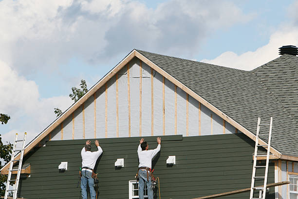 Professional Storm Damage Siding Repair technician working in Indian Hills, KY